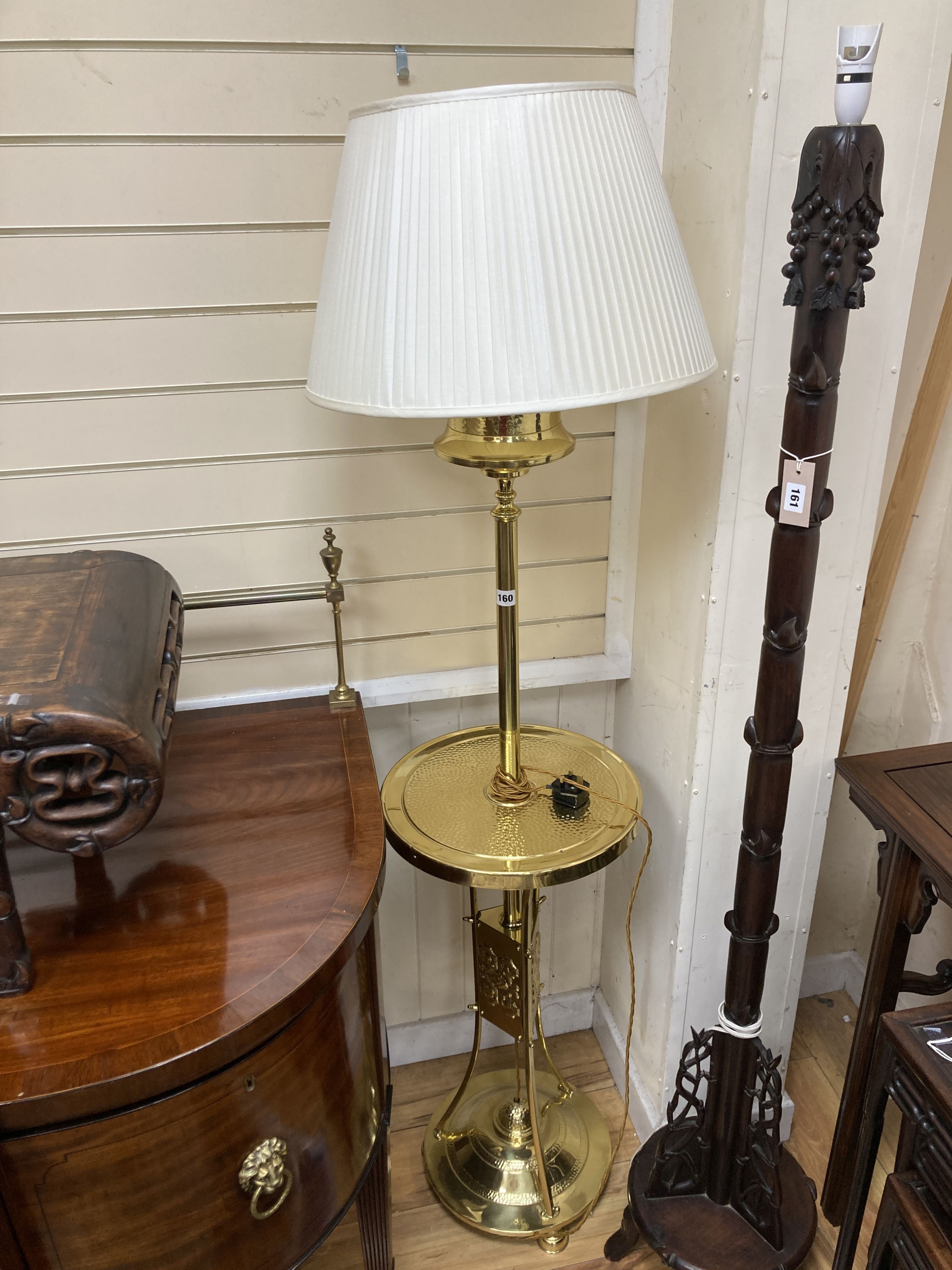 An early 20th century hammered brass standard lamp.